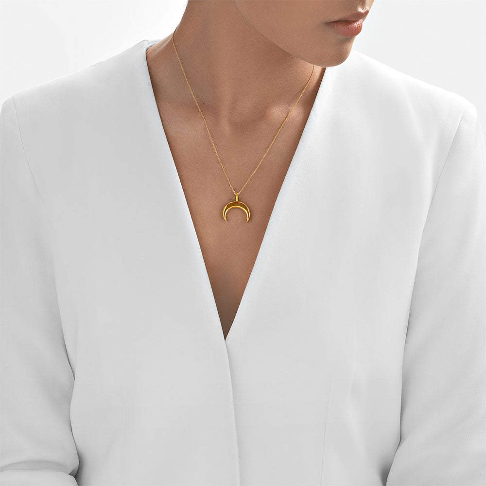 - Crescent moon gold pendant styled